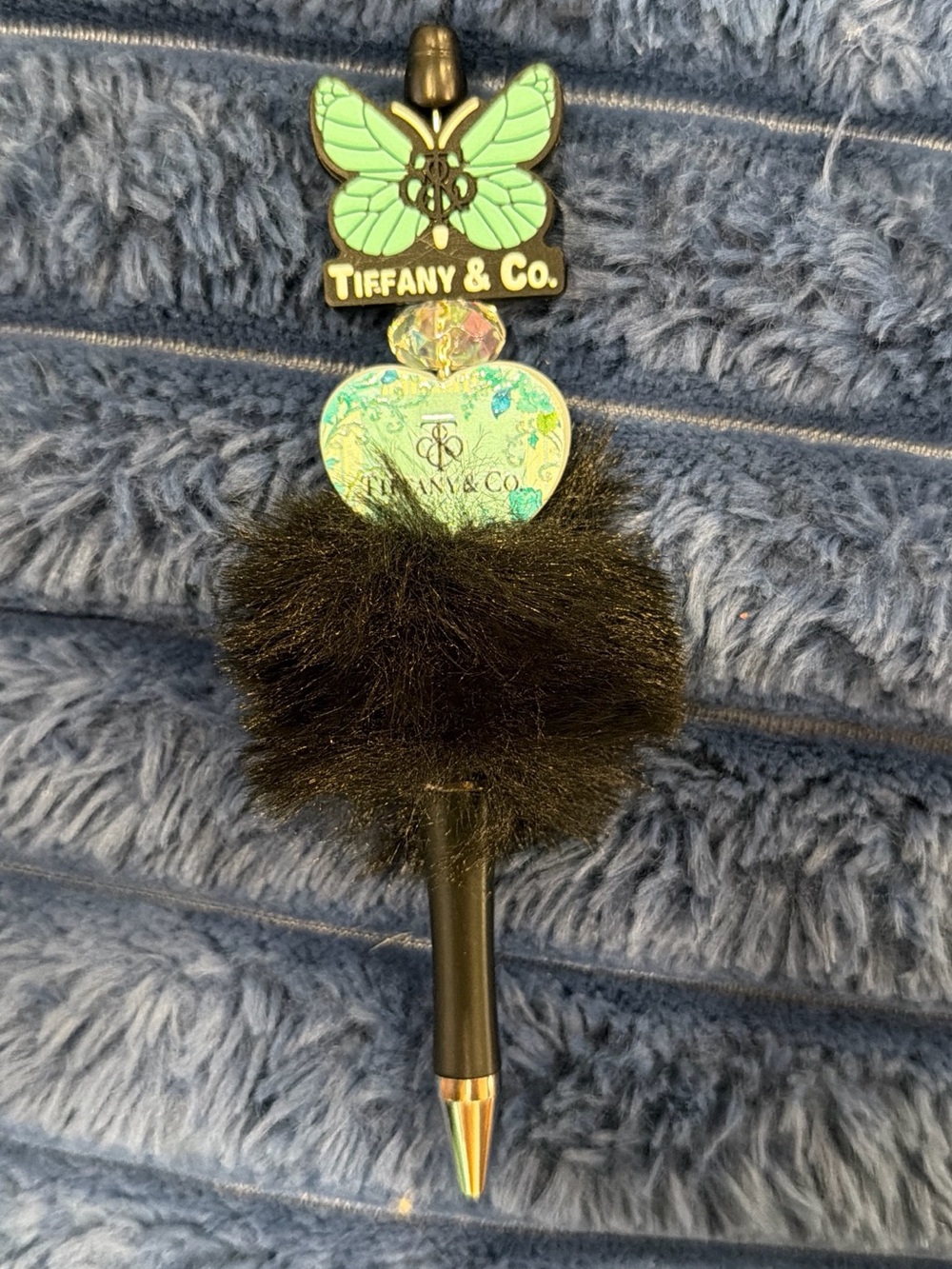 High-end fashionista black fuzzy beaded pen in black and turquoise tones.
